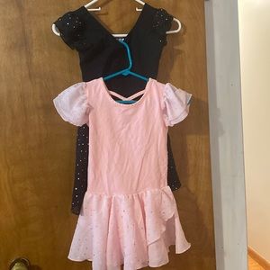 2 girls leotards. Black and pink with sparkles.